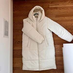 Dip Longline Hooded Puffer Coat in Ivory Cream